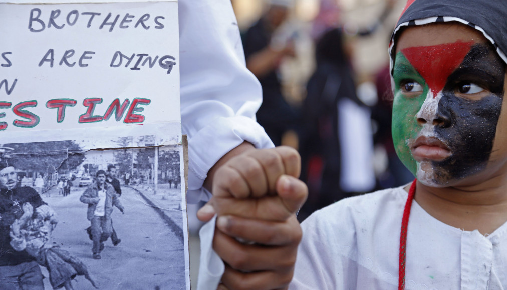 Un enfant d'Afrique du Sud, maquillé avec le drapeau de la Palestine. Cape Town, 2014. Un enfant d'Afrique du Sud, maquillé avec le drapeau de la Palestine. Cape Town, 2014. / Keystone